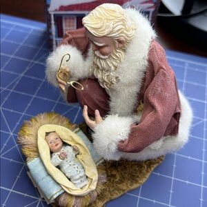 Ashton Drake “The Greatest Gift of All” Santa pausing to baby Jesus in manger.